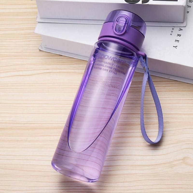 a purple toothbrush is sitting on a desk