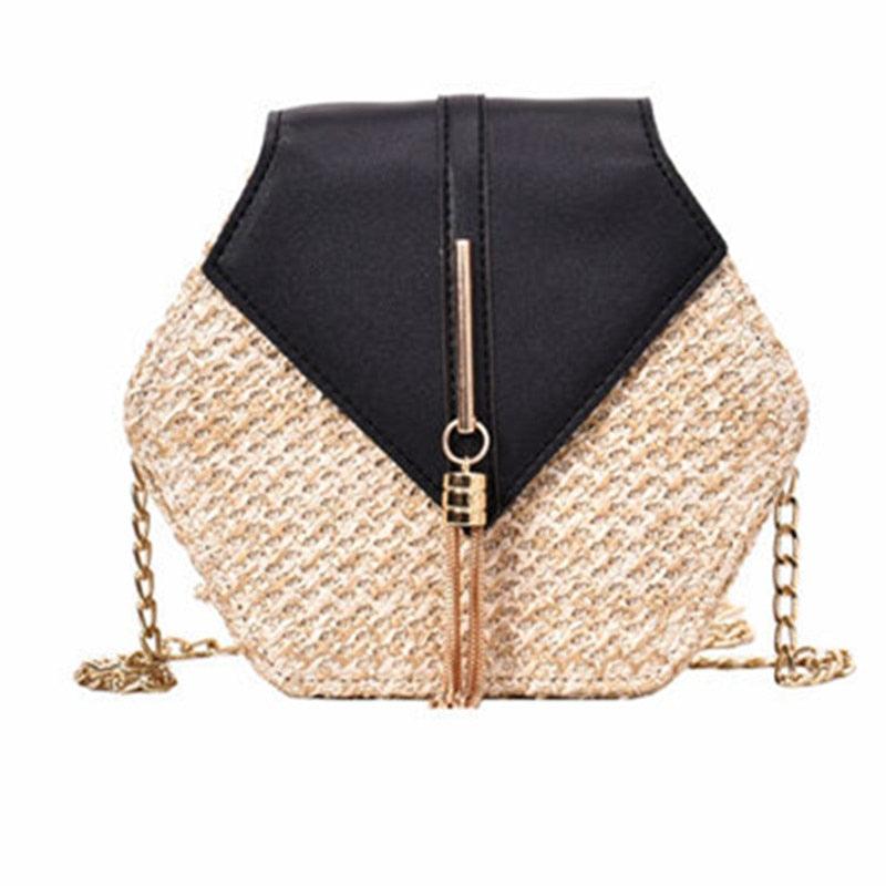 a black purse with a black bow on it