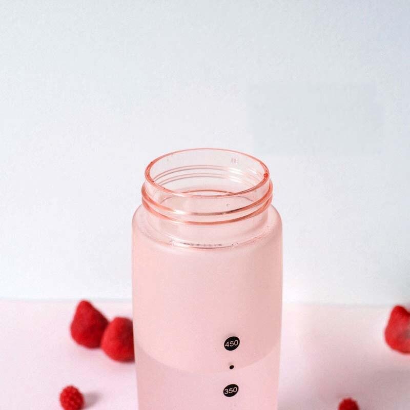 a glass of milk next to a glass jar