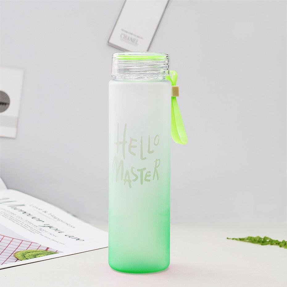 a green cup with a green liquid in it