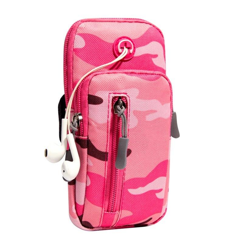 a pink suitcase is sitting on a bench