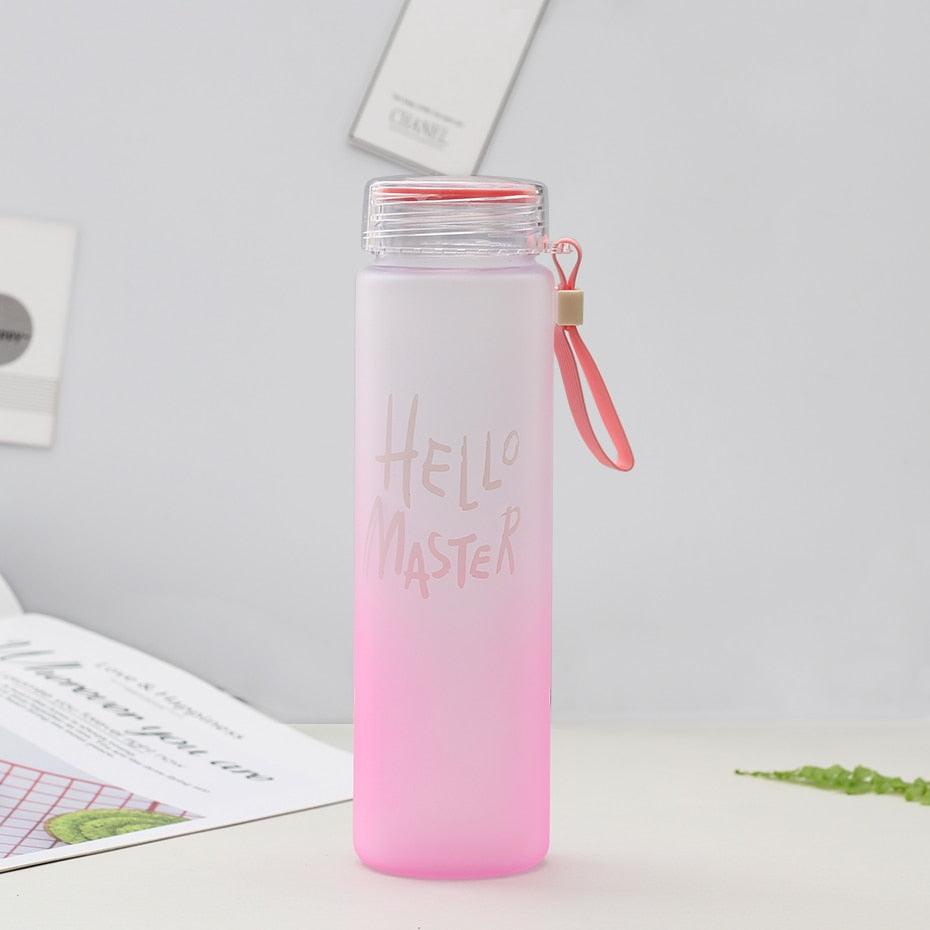 a pink toothbrush is in a pink cup