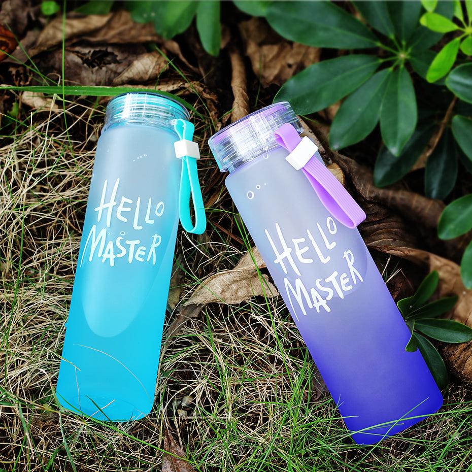 a bottle of water sitting next to a bottle of water