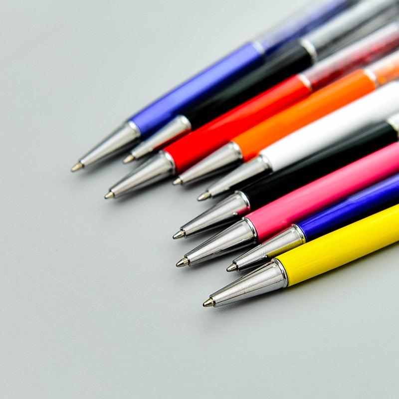 a bunch of pens pencils and a pair of scissors