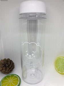 a glass bottle of water and a blender 