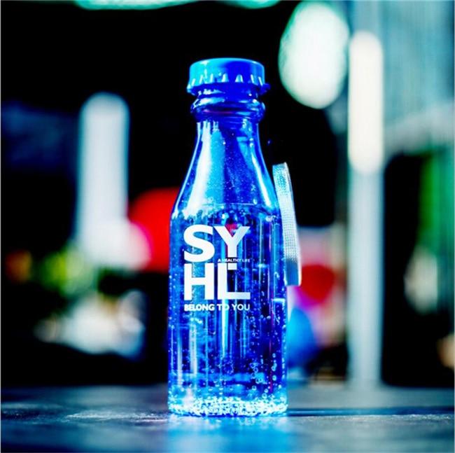 a bottle of water sitting on top of a counter 