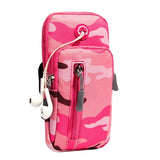 a pink suitcase is sitting on a bench 
