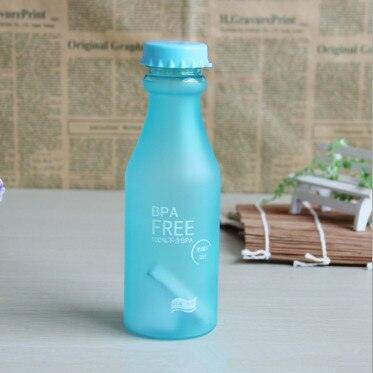 a blue bottle sitting on top of a table 