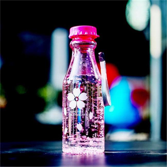 a tall glass bottle sitting on a table 