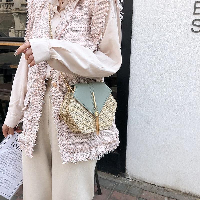 a woman in a white dress holding a purse 