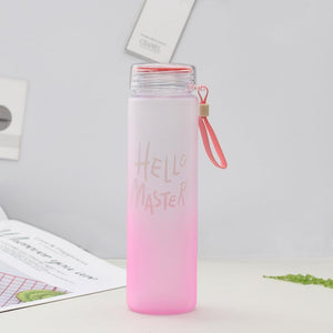 a pink toothbrush is in a pink cup 