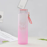 a pink toothbrush is in a pink cup 
