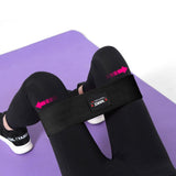 a close up of a pink and black suit case 