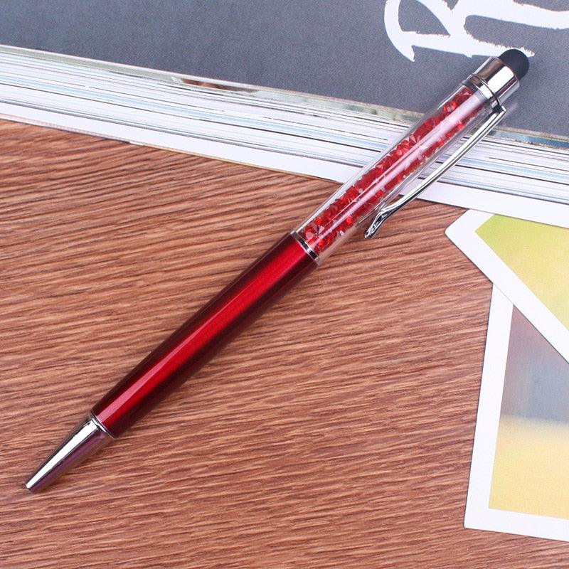 a pair of red scissors on a table 