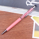 a pink toothbrush sitting on top of a wooden table 