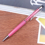 a pink toothbrush is sitting on a table 