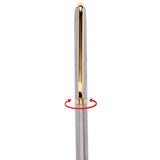 a close up of a toothbrush in a glass vase 