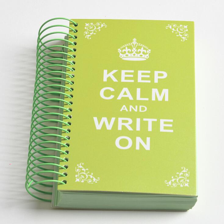 a green book that is sitting on a table 