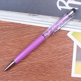 a pink toothbrush is sitting on a table 