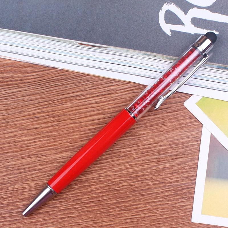 a pair of red scissors on a table 
