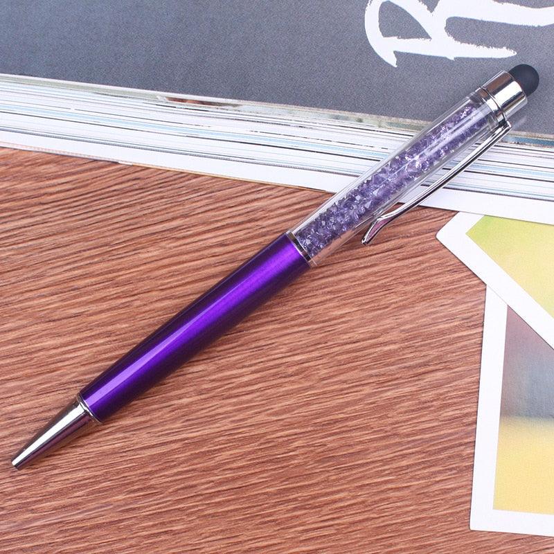 a pair of purple scissors sitting on top of a table 