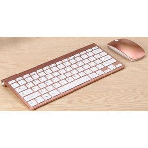 a computer keyboard sitting next to a mouse 