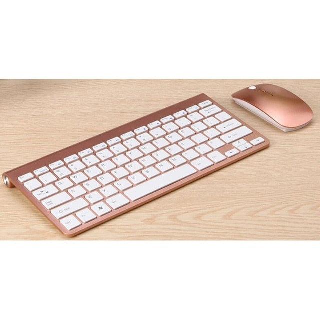 a computer keyboard sitting next to a mouse 